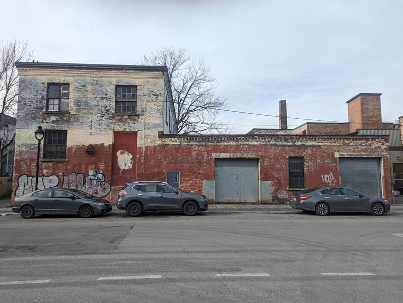 Run down building with cars